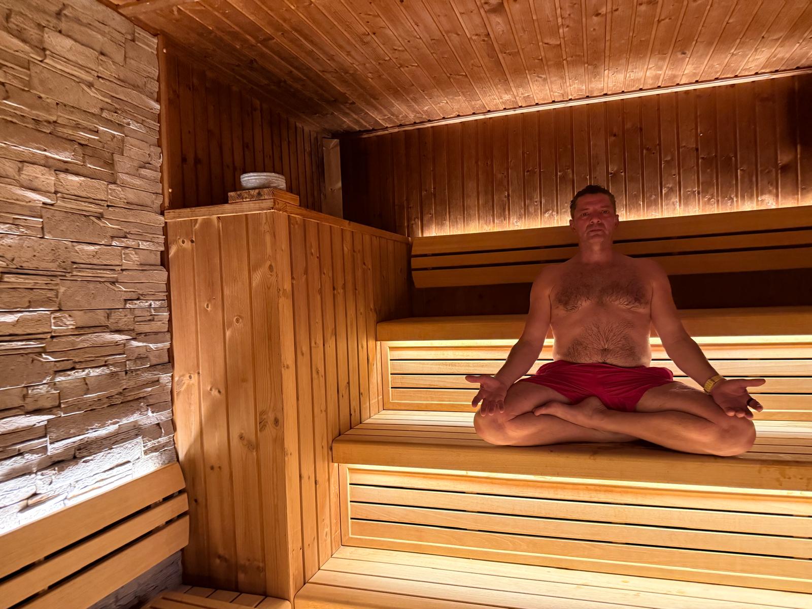 Doychin Karshovski sitting in a wooden sauna during one of his regular sessions