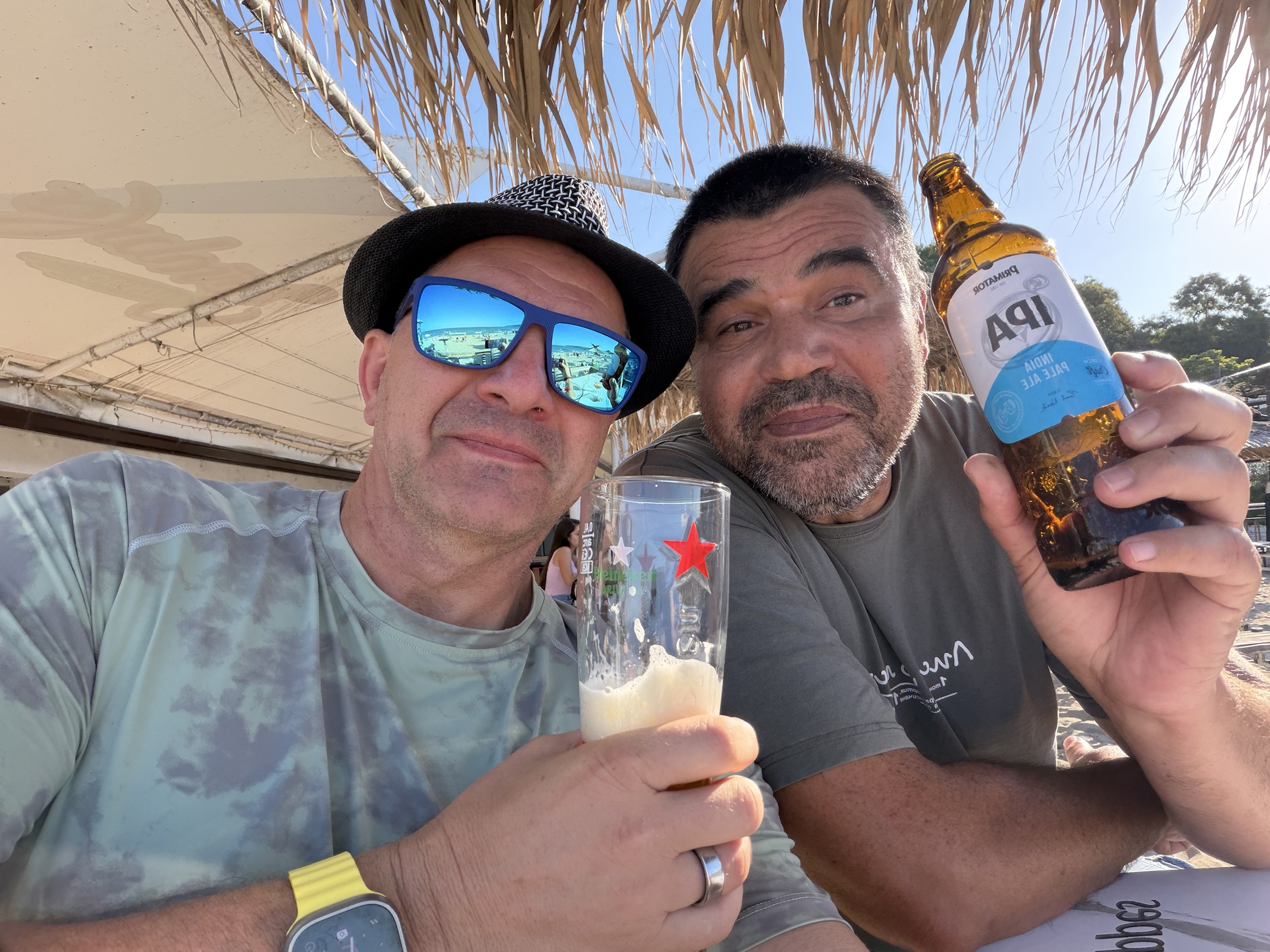 Doych Karshovski and his friend Iliyan sharing a beer at the beach