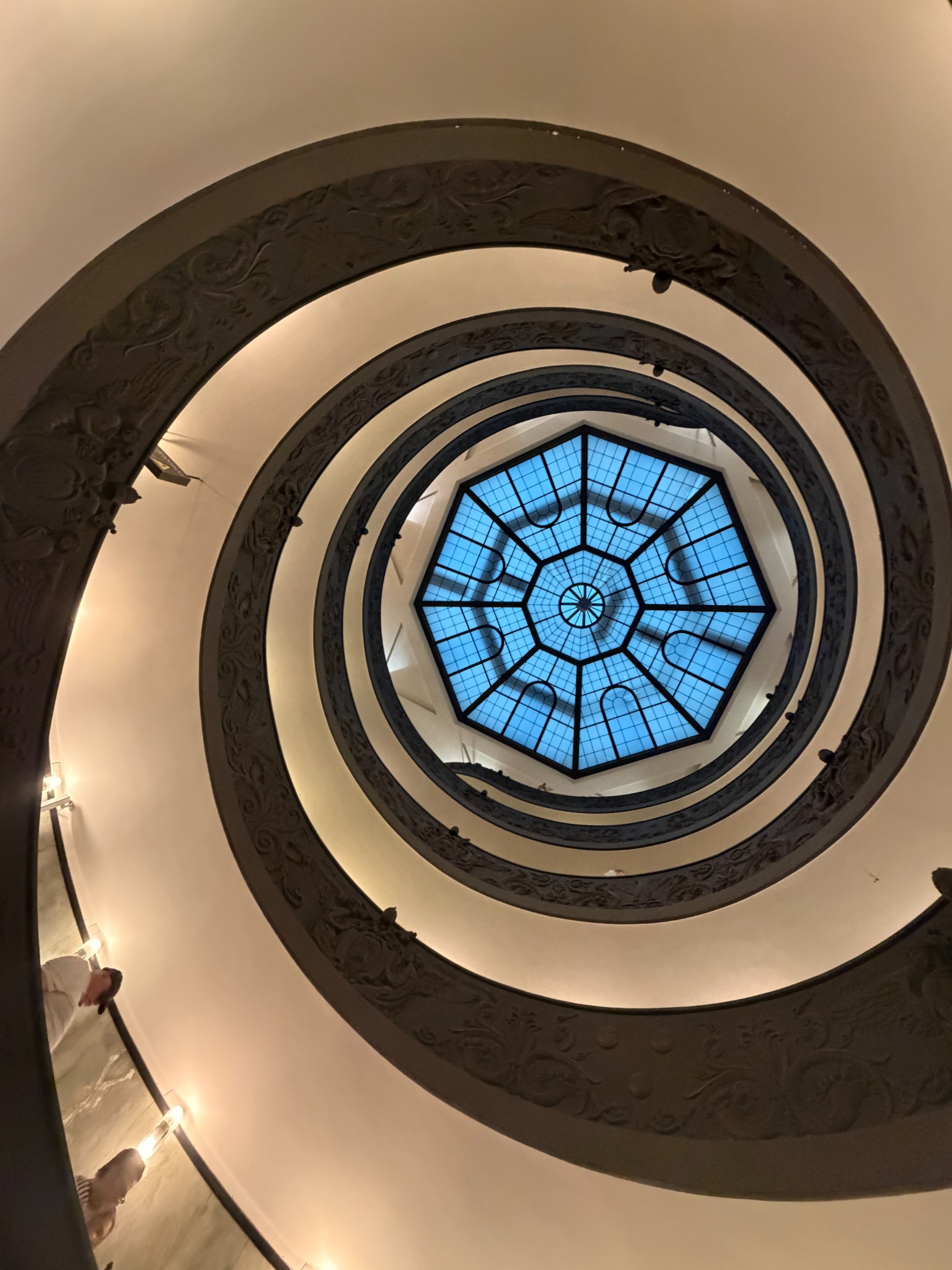 Looking upward through the spiralling Momo staircase at the Vatican Museums
